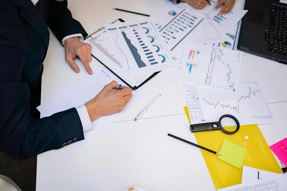 High-income professional reviewing financial reports for estimated tax planning strategy in 2025.