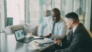 business professionals reviewing financial charts and real estate tax planning strategy