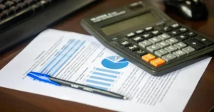 Depreciation recapture tax planning with financial documents and calculator