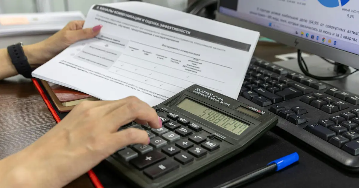 Real estate investment tax planning with calculator and financial documents