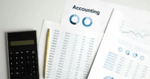 Accountant reviewing financial reports for S corporation tax planning
