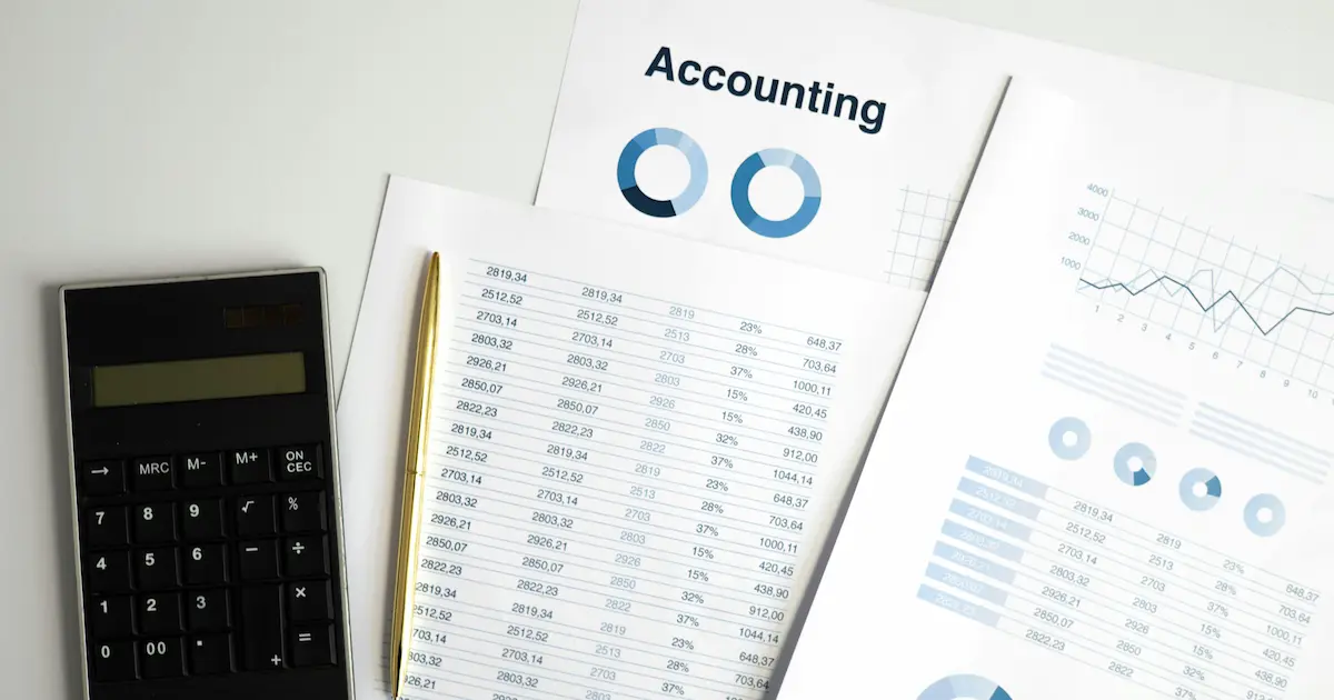 Accountant reviewing financial reports for S corporation tax planning